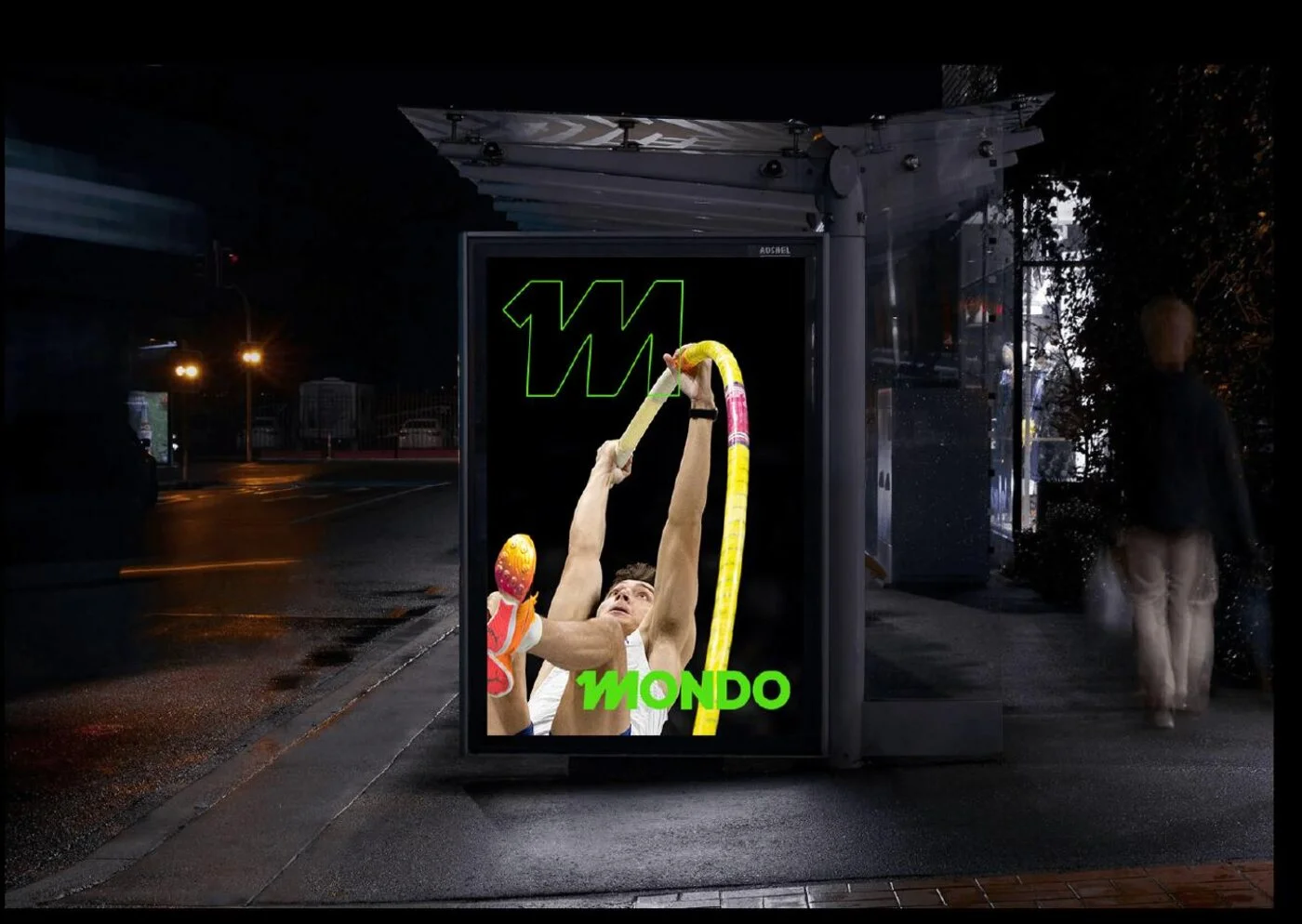 A lit bus shelter at night carrying the pole vault image